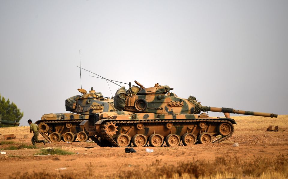  Turkish army tanks standing by in the Turkish Syrian border town of Karkamis, in the southern region of Gaziantep