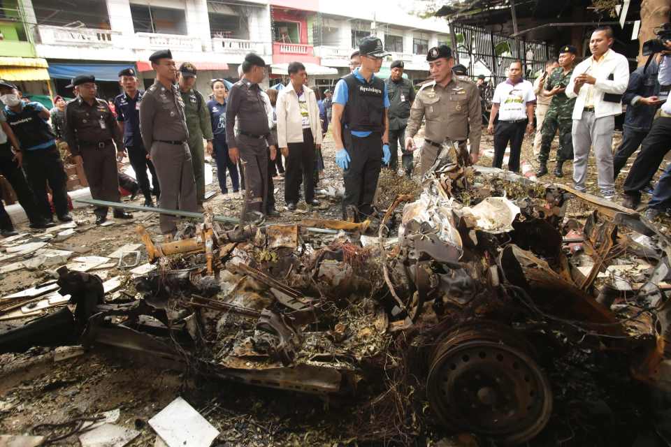  Response ... Blast site is visited by Royal Thai police chief Chakthip Chaijinda (centre right, brown uniform)