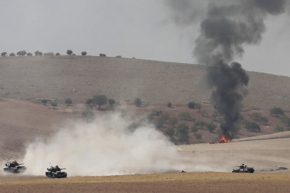  Turkish tanks and members of the Free Syrian Army pass the Syrian border as part of operation against ISIS in Syria