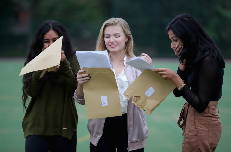  Withington Girls' School pupils Sejal Karmarkar, Elin Donnelly and Iyal Kannan, all aged 16, react as they open their GCSE exam results