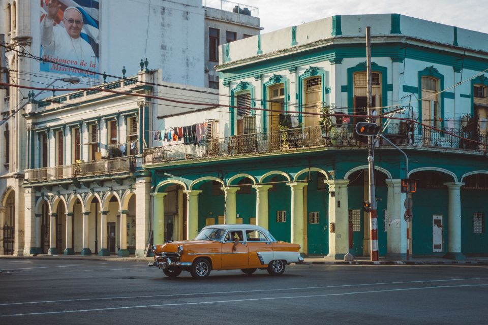 A mustard motor looks hot as it makes its way through Havana