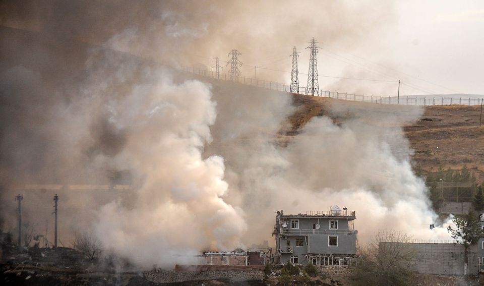 Smoke billowed from the building as Turkish Prime Minister Binali Yildirim vowed revenge on the attackers