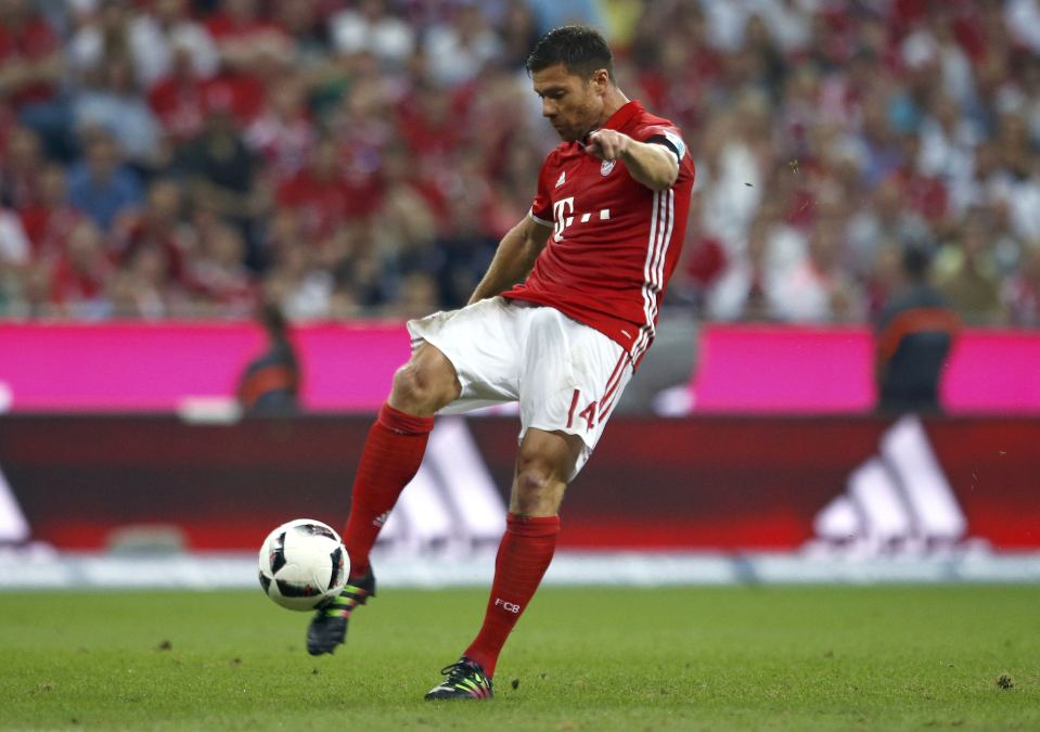  Xabi Alonso makes contact with the ball against Werder Bremen