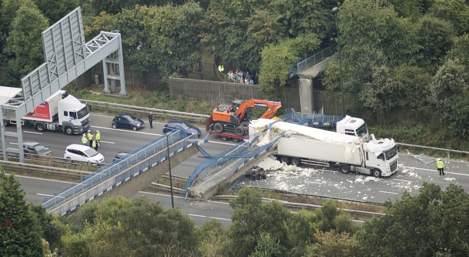  A bird's-eye view of the devastation after a digger on the back of a lorry slammed into a bridge as it passed