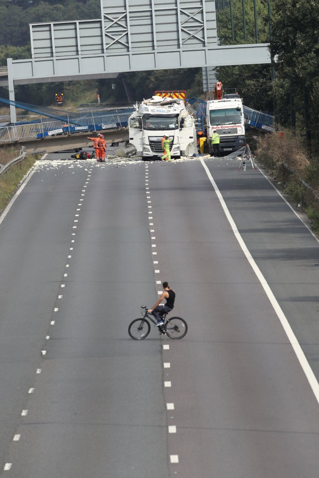  A passing cyclist stops to stare at the incredible scenes