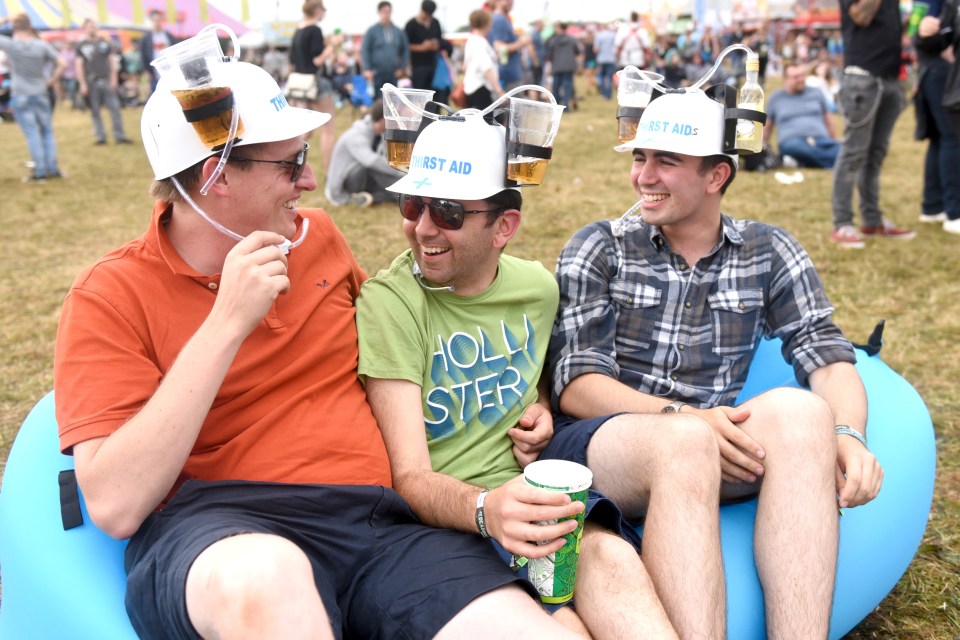  This trio cool down with beer or six at the Reading Festival