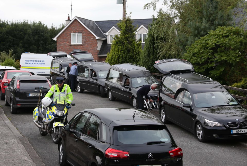 Several hearses could be seen lined up outside the property as the coffins were taken away to an undertakers