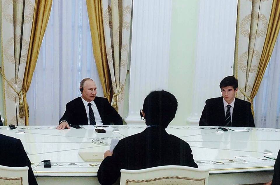 Vlad and the lads could bee seen sitting round the table wearing translation headsets during the meeting 