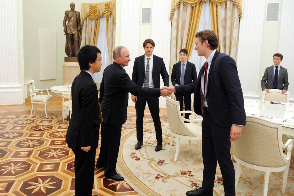 The boys pressed the flesh with the Russian President well ahead of Theresa May's first meeting at the G20