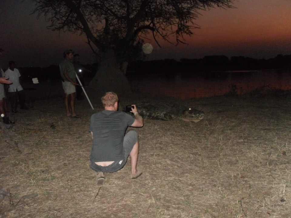 Harry takes a snap as the crow crawls back into the water