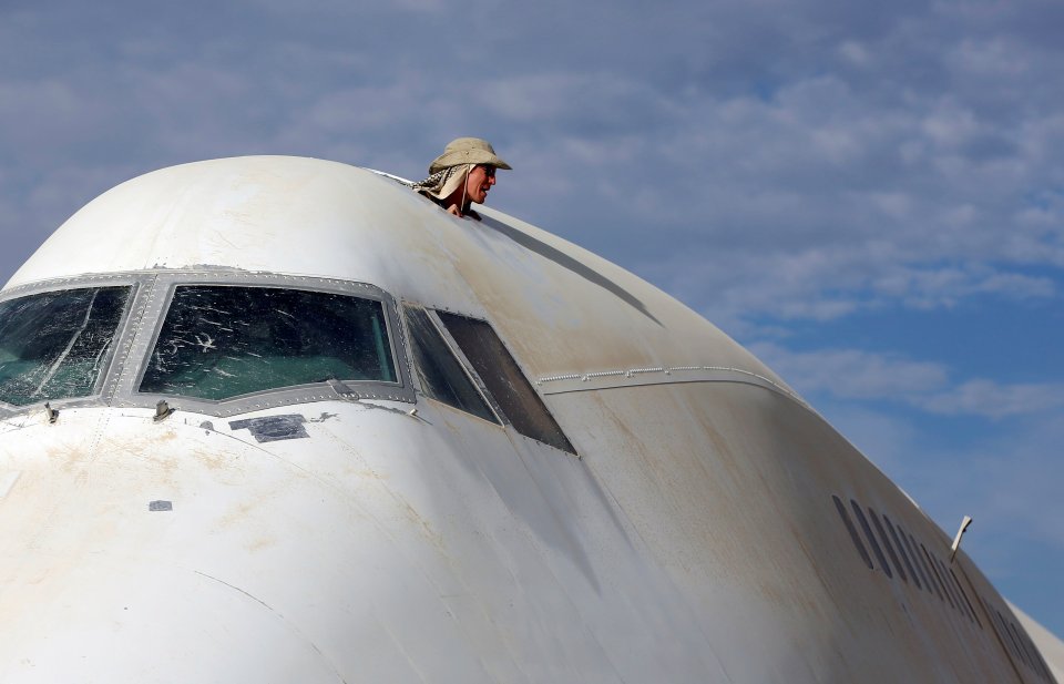  Flying high ... Burner pokes his head from a section of a Boeing 747