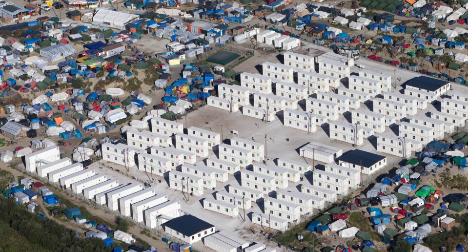  Around 1,500 people live in shipping containers provided by the French government as makeshift accomodation