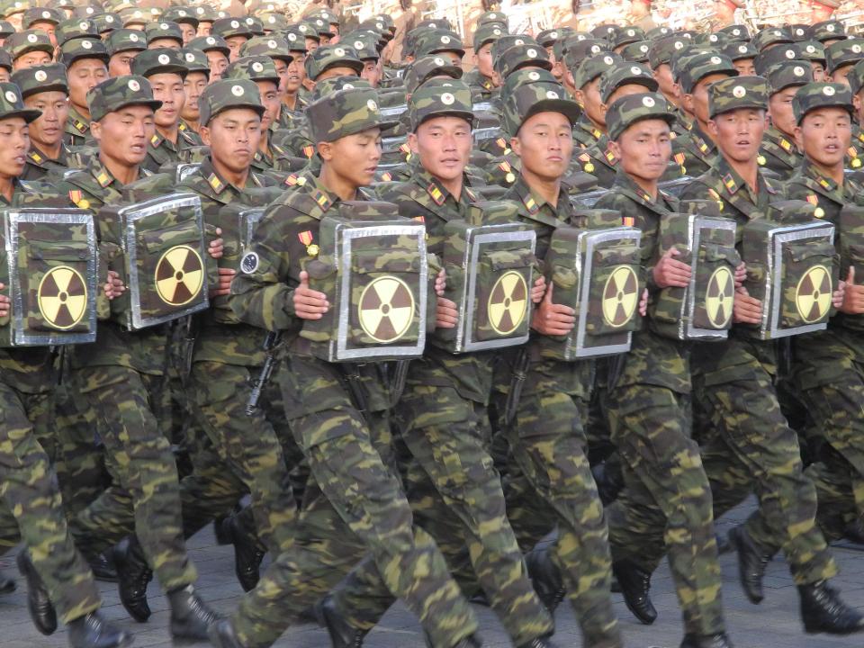  North Korean soldiers march through Pyongyang during a military parade last year carrying nuclear-marked backpacks