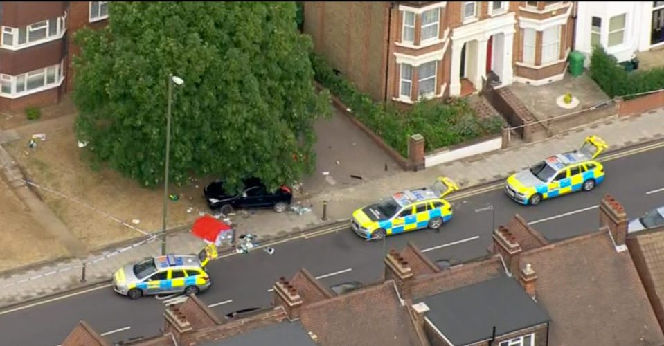 Witnesses said the black car, pictured here, lost control as it navigated a bend while being pursued by police