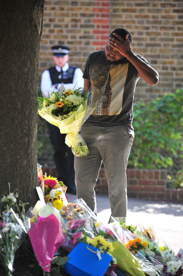 A man looks on in disbelief at the scene of yesterday's carnage