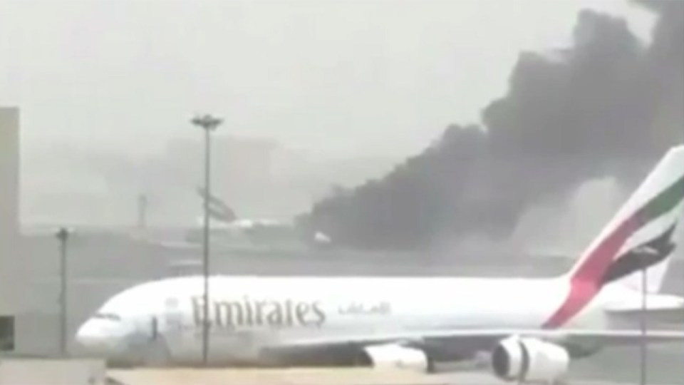  A giant plume of black smoke was visible from the airport's terminal as the plane went up in flames