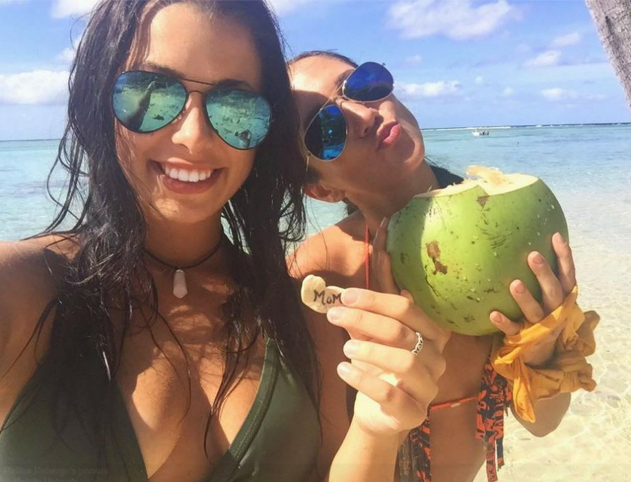  Lagacé and Roberge pictured drinking from a coconut in another of their exotic selfies