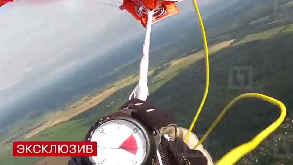 The skydiver desperately tries to manoeuvre the parachute above him but is unable to as he falls towards earth