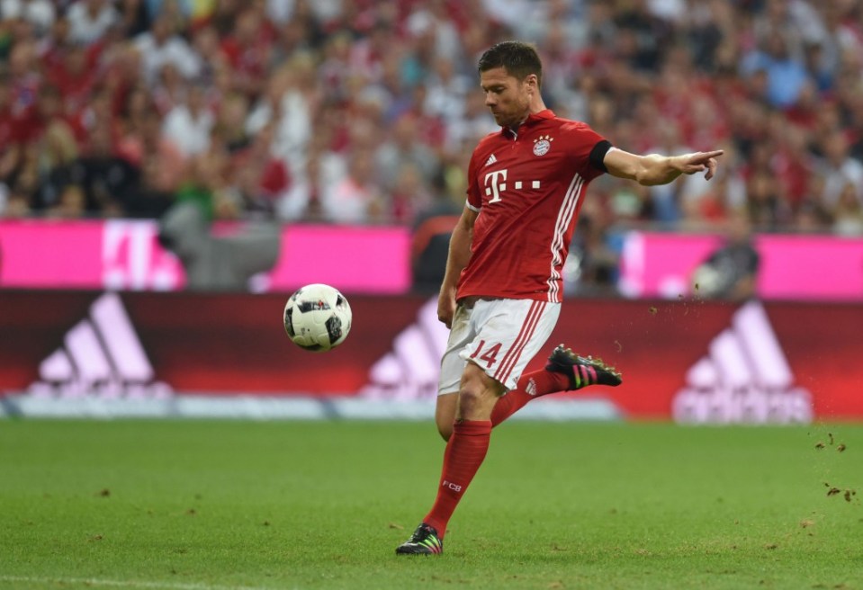 Bayern Munich's Spanish midfielder Xabi Alonso scores the first goal during the German first division Bundesliga football match between FC Bayern Munich vs SV Werder Bremen in Munich, southern Germany, on August 26, 2016. / AFP PHOTO / CHRISTOF STACHE / RESTRICTIONS: DURING MATCH TIME: DFL RULES TO LIMIT THE ONLINE USAGE TO 15 PICTURES PER MATCH AND FORBID IMAGE SEQUENCES TO SIMULATE VIDEO. == RESTRICTED TO EDITORIAL USE == FOR FURTHER QUERIES PLEASE CONTACT DFL DIRECTLY AT + 49 69 650050 CHRISTOF STACHE/AFP/Getty Images