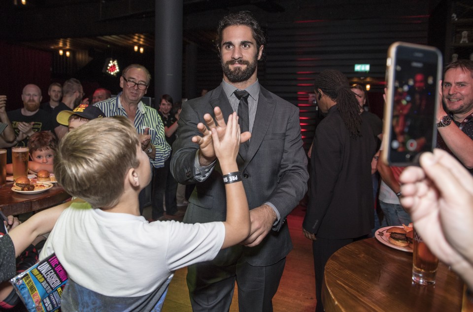  Seth Rollins meets a young fan at the O2