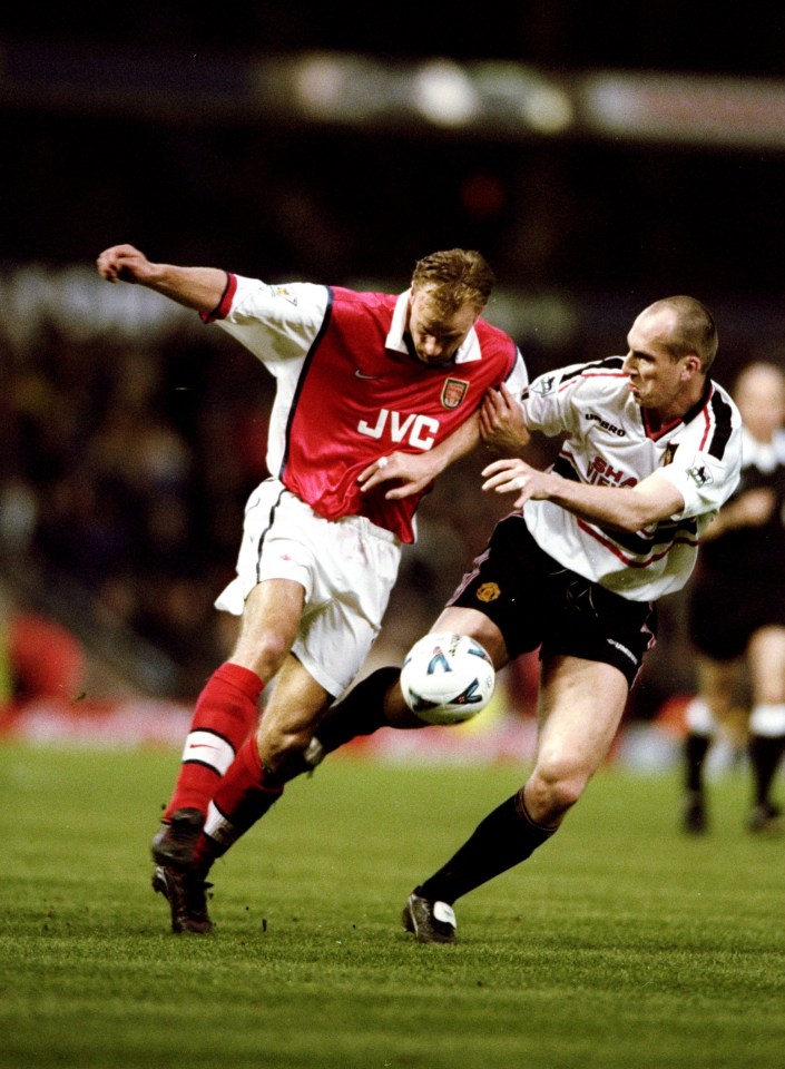 14 Apr 1999: Dennis Bergkamp of Arsenal is closely watched by Jaap Stam of Manchester United in the FA Cup semi-final replay at Villa Park in Birmingham, England. United won 2-1 after extra-time. Mandatory Credit: Shaun Botterill /Allsport