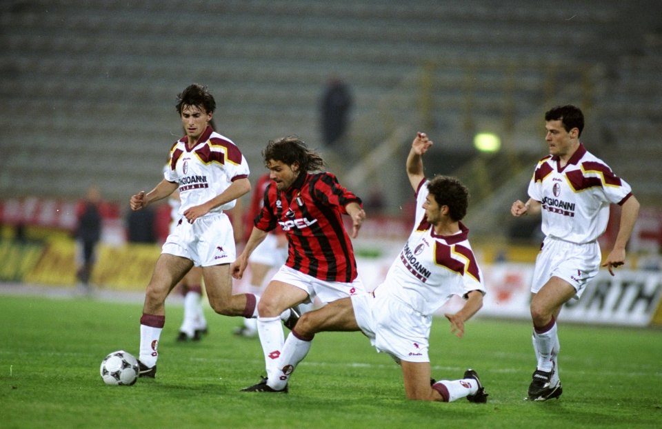 24 Apr 1995: Marco Simone (centre) of AC Milan takes on the Torino defence during a match at the San Paulo Stadium in Turin, Italy. Mandatory Credit: Allsport UK /Allsport