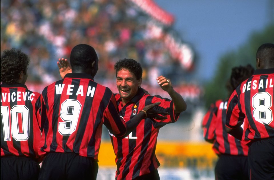 27 Aug 1995: Roberto Baggio of AC Milan and team mate George Weah (9) celebrate during a Serie A match against Padova Calcio at the Silvio Appiani Stadium in Padua, Italy. Mandatory Credit: Allsport UK /Allsport