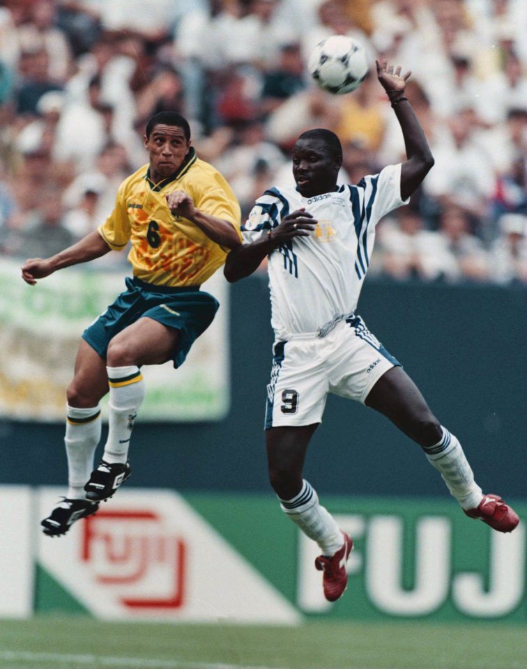 14 Jul 1996: Forward George Weah #9 of the FIFA World Stars and defenseman Roberto Carlos #11 of the Brazil All Stars go up for the ball in the second half of their game at Giants Stadium in East Rutherford, NJ.