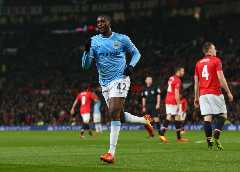 MANCHESTER, ENGLAND - MARCH 25: Yaya Toure of Manchester City celebrates scoring the third goal during the Barclays Premier League match between Manchester United and Manchester City at Old Trafford on March 25, 2014 in Manchester, England. (Photo by Alex Livesey/Getty Images)