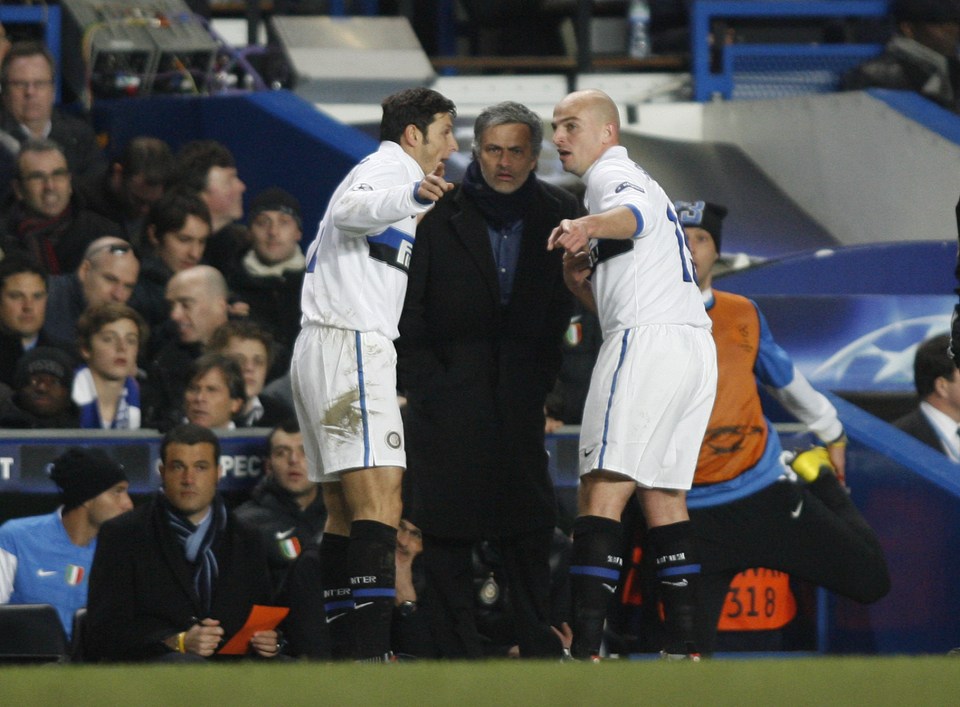 Javier Zanetti and Esteban Cambiasso of Inter Milan receive instruction from Coach Jose Mourinho during the UEFA Champions League First Knock-out Round 2nd Leg match between Chelsea and Inter Milan at Stamford Bridge in London, UK. (Photo by ben radford/Corbis via Getty Images)