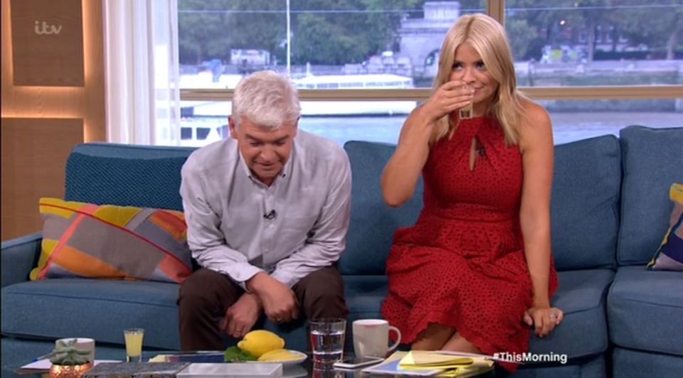  Holly and Phil got into the party spirit by downing shots on This Morning