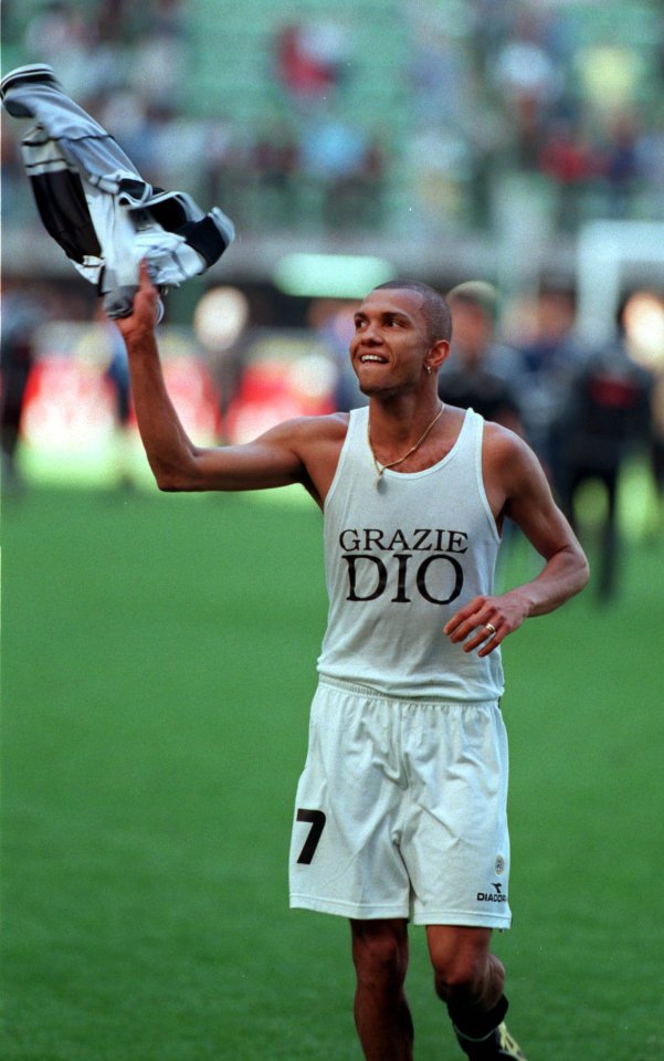 Udinese's Marcio Amoroso of Brazil waves his jersey as he leaves the field at the end of the Italian first division match against Inter at the Milan San Siro stadium Sunday, April 25, 1999. His t-shirt reads "Thank you God". Udinese won 3-1. (AP Photo/Carlo Fumagalli)