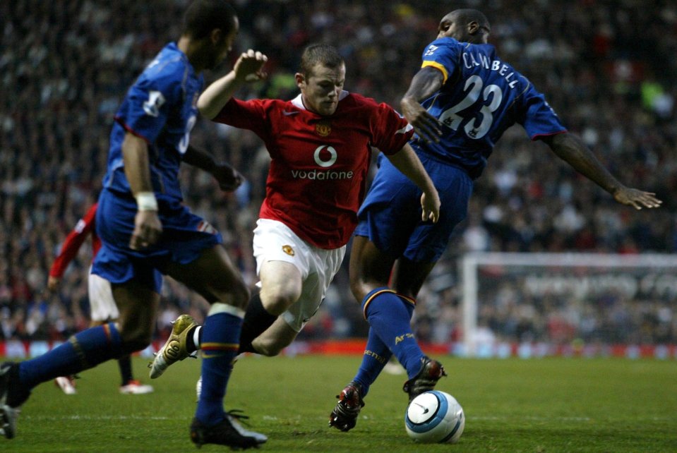 MANCHESTER UNITED 2 V ARSENAL 0...24TH OCTOBER 2004...PICTURE BY MARK ROBINSON...WAYNE ROONEY (MAN.U) TAKES A TUMBLE UNDER THE CHALLENGE OF SOL CAMPBELL (ARSENAL) FOR A PENALTY