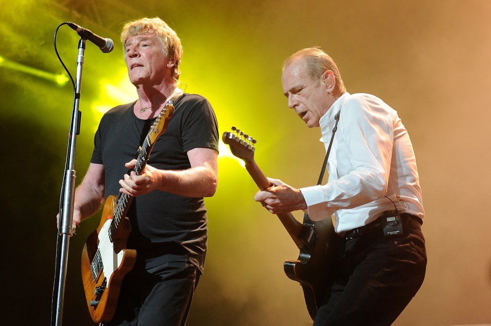  Rick Parfitt (L) and Francis Rossi (R) performing with Status Quo in March