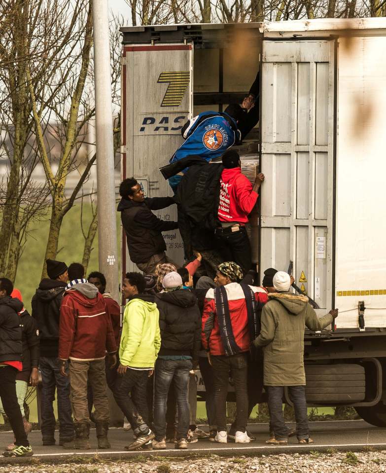  Robert Goodwill says Britain is helping to build a barrier to try and stop scenes like this in Calais - where migrants enter the trailers of trucks before they reach the port