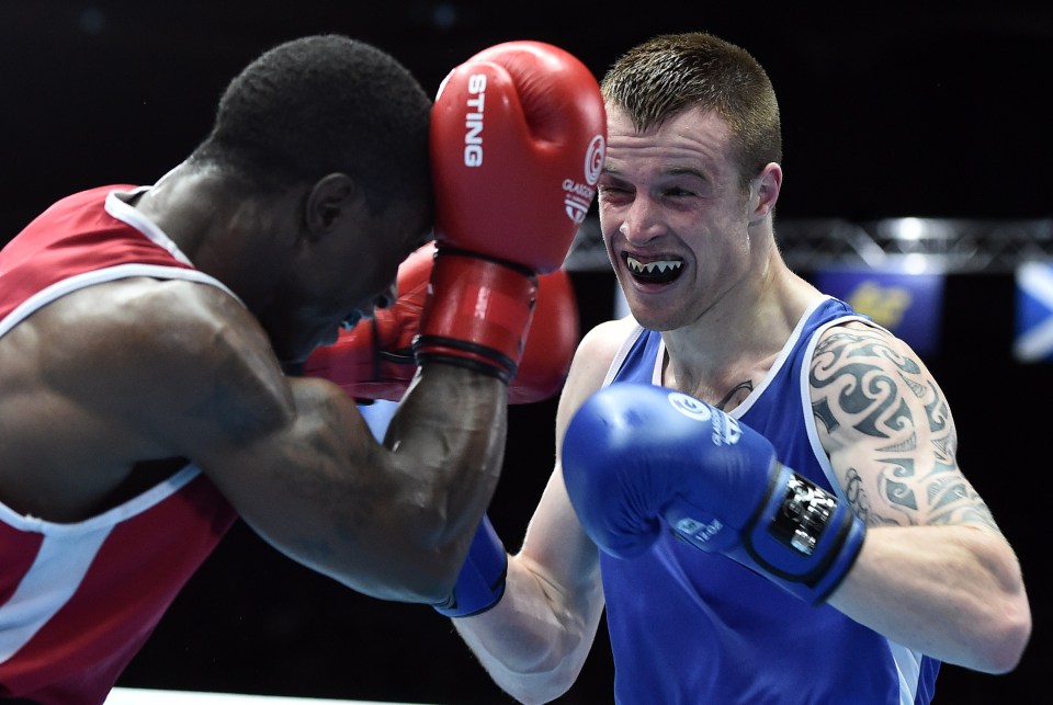 Northern Ireland's Steven Donnelly (R) fights with Canada's Custio Clayton in 2014