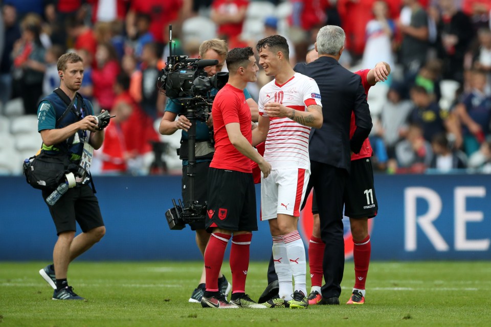  Taulant (left) and Granit (right) embrace after Switzerland's 1-0 Euro 2016 victory over Albania