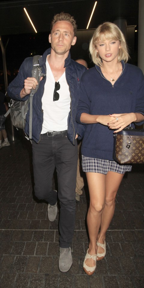 Ready to party . . . Tom and Taylor look bronzed and blissful in romantic snap