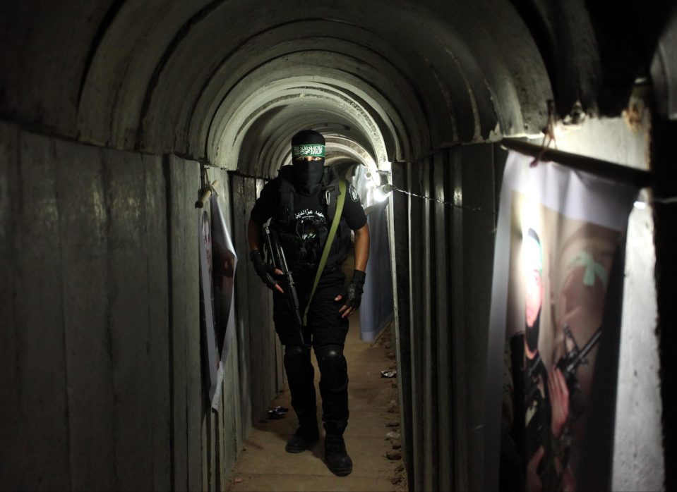 A member of Hamas stands inside one of the terror tunnels linking the Gaza Strip and Israel