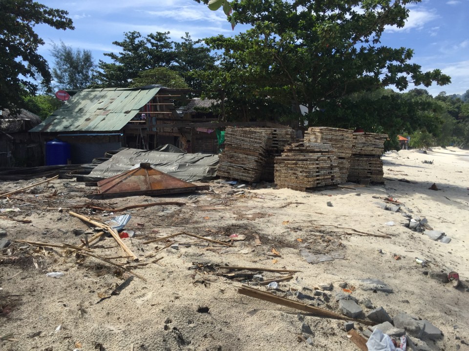  Directly behind the resort was a man-made reservoir surrounded by tin huts and a sprawling building site