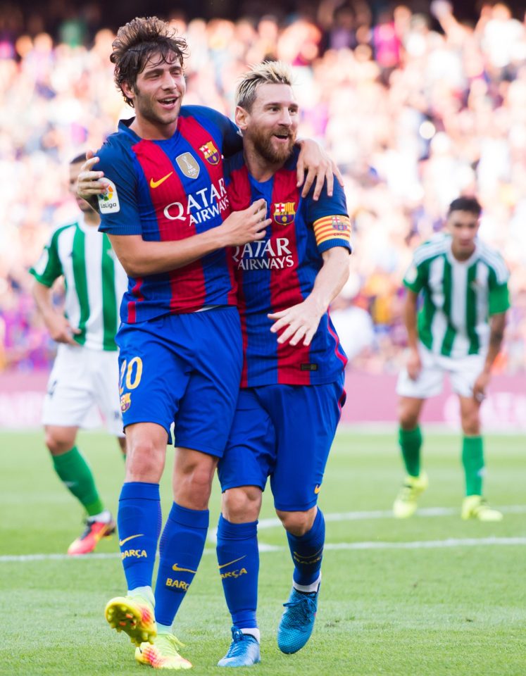  Roberto celebrates with Lionel Messi in the Liga victory over Betis