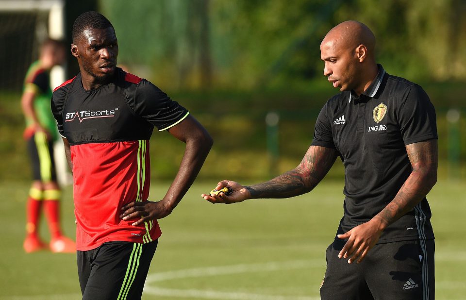 Assistant coach Thierry Henry talks Christian Benteke through tactics in the new regime under Roberto Martinez