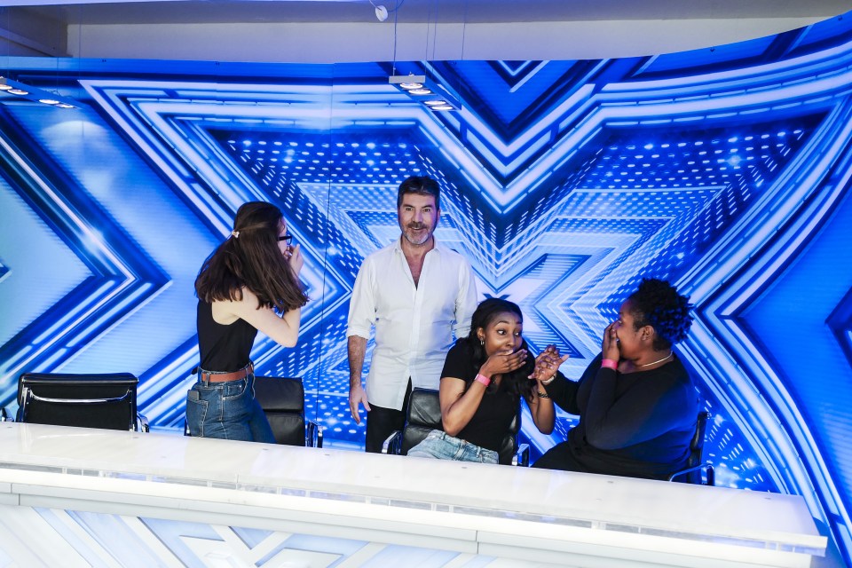 Surprise! Simon Cowell stuns X Factor fans as he crashes their photo opp