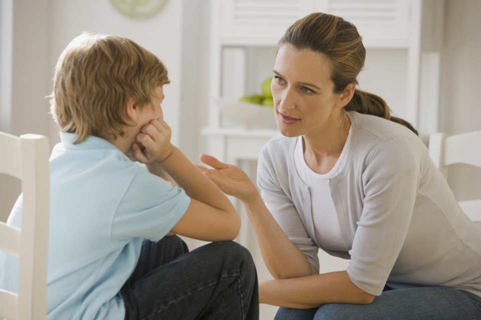 Mother having discussion with son