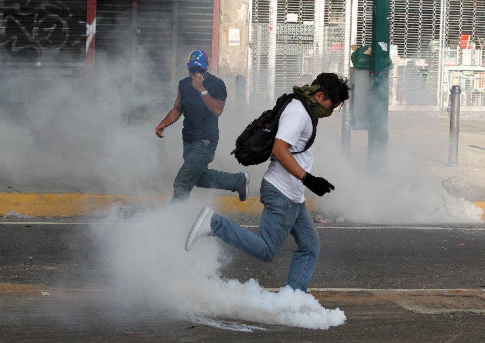  Cops clashed with protestors and tear gas was used in wake of march in the capital of the South American country Caracas