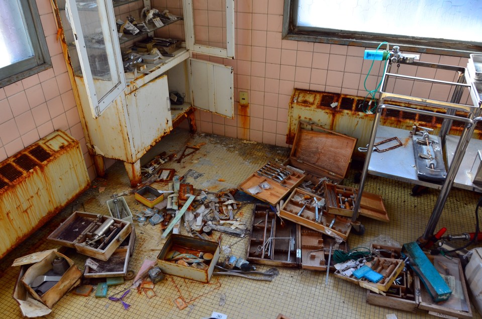 Medical equipment is strewn across the floor of the abandoned Hokkaido Hospital