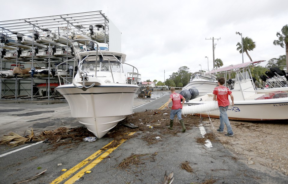  Boats lie scattered across the road as the the hurricane passed through Steinhatchee, Florida