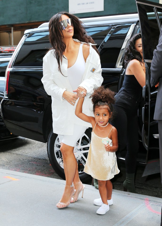  Fashionista in training... Kim holds on to the adorable North as she steps out in the city