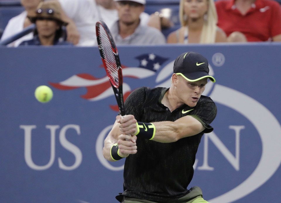  Kyle Edmund plays a return to John Isner