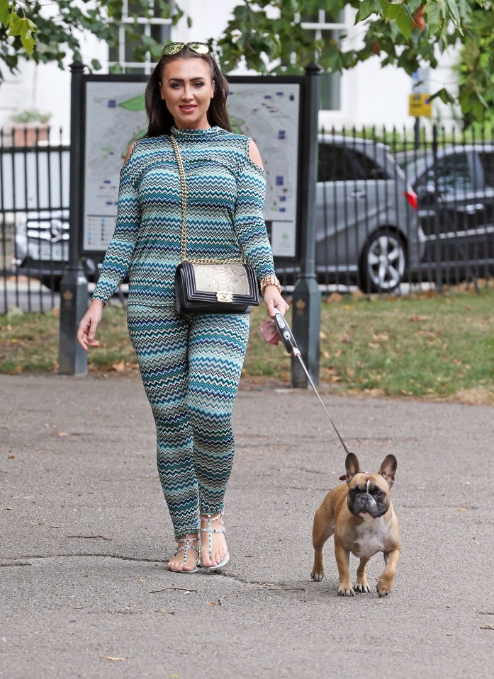 The Essex babe accessorised with shades and a cross body handbag